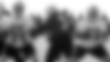 QB Carson Palmer and his offensive line practice the positioning on a play.