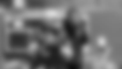 QB Terrelle Pryor steps back to pass under the watchful eye of QB coach John DeFilippo.