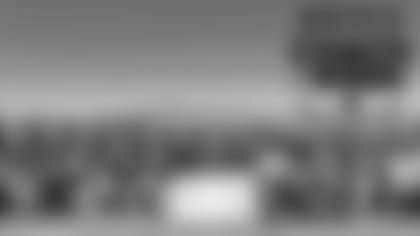 Canyon Springs High School's football coach, Gus McNair is awarded with the Tom Flores High School Coach of the Week by Raiders alumnus, Roy Hart, at Canyon Springs High School, Wednesday, September 19, 2018, in North Las Vegas, Nevada.