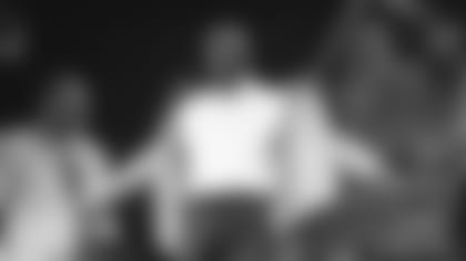 Rams Legend Isaac Bruce gets his gold jacket at Pro Football Hall of Fame induction.