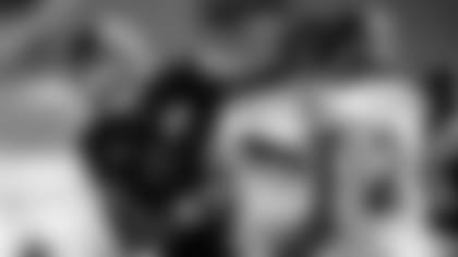 QB Lamar Jackson jokes around with CB Marcus Peters