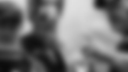 QB Lamar Jackson looking over film at practice.