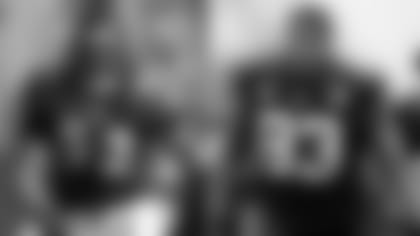 Ray Lewis and Calais Campbell in action during an NFL game.