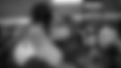 Left: QB Lamar Jackson; Right: QB Coach James Urban