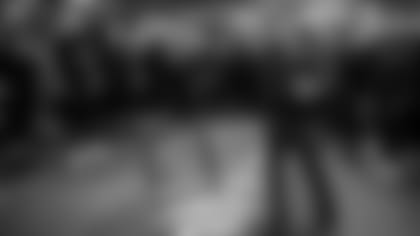 Head coach John Harbaugh talks to the team