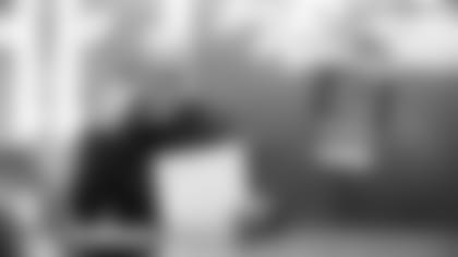 Baltimore Ravens General Manager Eric Decosta makes a call from the Draft Room at the Under Armour Performance Center in Owings Mills, MD.