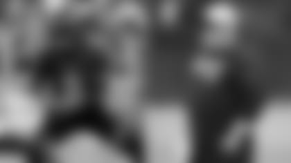 Left: QB Lamar Jackson; Right: Offensive Coordinator Greg Roman