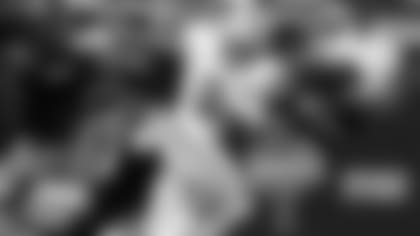 J.K. Dobbins runs as TCU defenders try to tackle him.