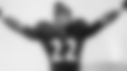 Jimmy Smith is welcomed to the field before an NFL game.