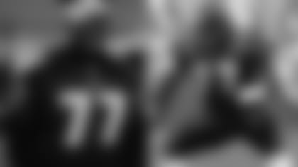 Right: Tackle Orlando Brown Jr. wears the jersey of his father, former Ravens tackle Orlando Brown. Left: Former Ravens tackle Orlando Brown on the field during a game.