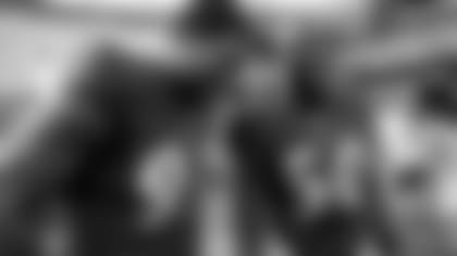 Calais Campbell and Justin Houston share a laugh before a game (Baltimore Ravens/Shawn Hubbard)