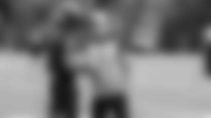 Left: QB Lamar Jackson; Right: Head Coach John Harbaugh