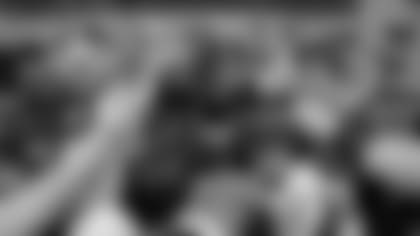 Ravens huddle after practice