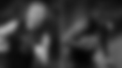 Left: Michigan defensive lineman Aidan Hutchinson runs during a drill at the NFL football scouting combine, Saturday, March 5, 2022, in Indianapolis.; Right: Michigan defensive lineman David Ojabo runs during a drill at the NFL football scouting combine, Saturday, March 5, 2022, in Indianapolis.