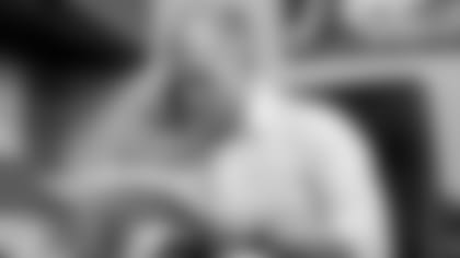 General Manager Eric DeCosta makes a phone call.