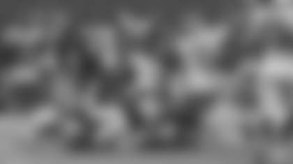 Kendall Fuller, Daron Payne and Kevin Pierre-Louis work together to bring down Rams tight end Gerald Everett. (Emilee Fails/Washington Football Team)