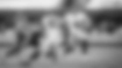 Taylor Heinicke scrambles from a defender during the Washington Football Team's Week 11 matchup against the Carolina Panthers. (Emilee Fails/Washington Football Team)