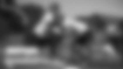 Sam Cosmi runs through sled drills during the Washington Football Team's rookie minicamp. (Emilee Fails/Washington Football Team)