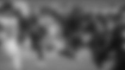 Taylor Heinicke scrambles away from a defender during the Washington Football Team's Wild Card game against the Tampa Bay Buccaneers. (Elijah Walter Griffin Sr./Washington Football Team)