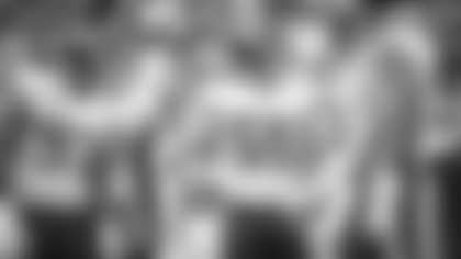 Cole Holcomb huddles his teammates together before the Washington Football Team's defense runs a play against the Green Bay Packers. (Matt Becker/NFL)