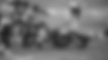 Chase Young and Jeremy Reaves make a tackle on David Moore in the Washington Football Team's game against the Seattle Seahawks. (Elijah Walter Griffin Sr./Washington Football Team)