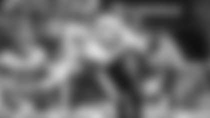 Jamin Davis and Cole Holcomb combine for a tackle during the Washington Football Team's game against the Atlanta Falcons. (Emilee Fails/Washington Football Team)