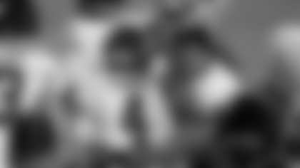 Washington Football Team defensive end Chase Young (99) points to quarterback Taylor Heinicke (4) after a touchdown during an NFL wild-card playoff football game against the Tampa Bay Buccaneers, Saturday, Jan. 9, 2021, in Landover, Md. The Buccaneers won 31-23.(Perry Knotts via AP)