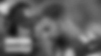 Kansas City Chiefs coach Andy Reid, left, talks with quarterback Alex Smith during the first half of an preseason NFL football game against the San Francisco 49ers at Arrowhead Stadium in Kansas City, Mo., Friday, Aug. 16, 2013. (AP Photo/Ed Zurga)