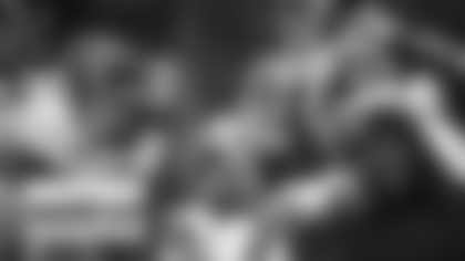 Washington offensive and defensive lines get ready to run a play during OTAs. (Emilee Fails/Washington Football Team)