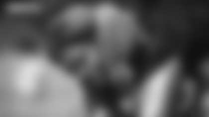 Washington Football Team defensive end Chase Young stares down the camera while warming up for practice. (Emilee Fails/Washington Football Team)