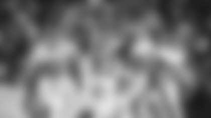 Jonathan Allen celebrates a play with Chase Young and Montez Sweat. (Emilee Fails/Washington Football Team)