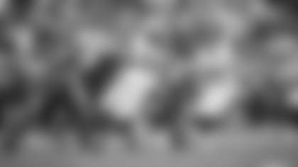 Daron Payne and James Smith-Williams take down Cam Newton for a three-yard sack during the Washington Football Team's win over the Carolina Panthers. (Emilee Fails/Washington Football Team)