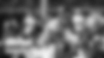 Ryan Fitzpatrick prepares to take the snap during Washington's first practice of training camp. (Emilee Fails/Washington Football Team)