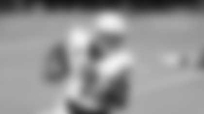 Liberty quarterback Malik Willis (7) runs up field against Coastal Carolina during the second half of the Cure Bowl NCAA college football game Saturday, Dec. 26, 2020, in Orlando, Fla. (AP Photo/Matt Stamey)