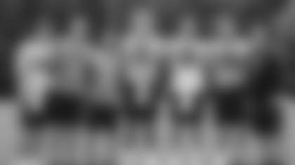 Washington's quarterbacks take a group shot at the end of minicamp. (Emilee Fails/Washington Football Team)