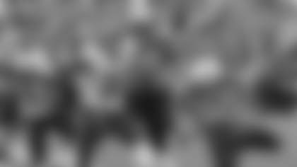 Tennessee Titans quarterback Ryan Fitzpatrick (4) dives into the end zone to score a touchdown on a 9-yard run against the Kansas City Chiefs in the fourth quarter of an NFL football game on Sunday, Oct. 6, 2013, in Nashville, Tenn. Chiefs' Marcus Cooper (31) and Quintin Demps (35) defend on the play. (AP Photo/Wade Payne)