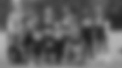 Washington's linebackers pose for the camera at the end of practice to conclude minicamp. (Emilee Fails/Washington Football Team)