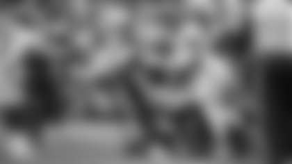 Jonathan Allen and Landon Collins tackle Christian McCaffrey during the Washington Football Team's game against the Carolina Panthers. (Emilee Fails/Washington Football Team)