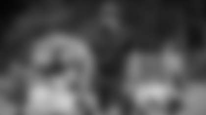 Defensive coordinator Jack Del Rio walks by his players during the stretch period of practice on Sept. 9, 2020. (Elijah Walter Griffin Sr./Washington Football Team)