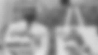 In this July 30, 1983, file photo, former Washington halfback and wide receiver Bobby Mitchell poses with his bronze bust after being inducted into the Pro Football Hall of Fame in ceremonies in Canton, Ohio. (AP Photo/Gus Chan, File)