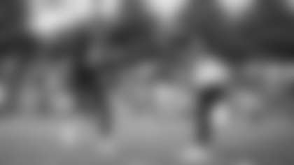 Landon Collins shakes hands with Jeremy Reaves in between plays. (Emilee Fails/Washington Football Team)