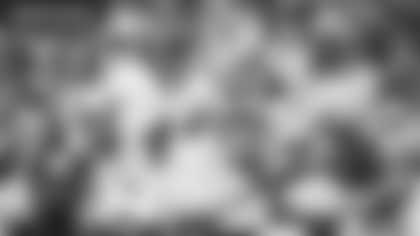 Taylor Heinicke evades a Denver Broncos defender during the Washington Football Team's Week 8 game. (Emilee Fails/Washington Football Team)