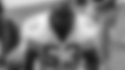 New Orleans Saints linebacker Vaughan Johnson (53) discusses strategy with teammates during a game against the Cincinnati Bengals in Cincinnati, OH, Nov. 4, 1990. The Saints defeated the Bengals 21-7.