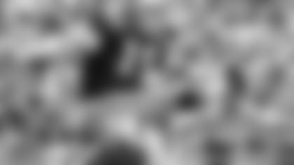 New Orleans Saints kicker Tom Dempsey (19) kicks a field goal on the hold of safety Joe Scarpati (21) during an NFL game in New Orleans, 1970. (AP Photo/NFL Photos)