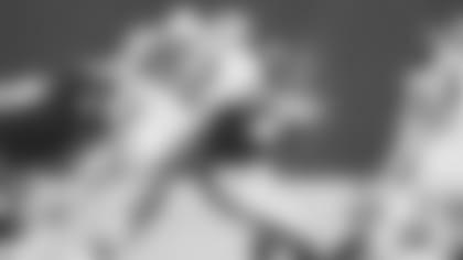 New Orleans Saints left tackle Bob Pollard (82) collars Pittsburgh Steelers running back Franco Harris (32) after he picks up four yards during first quarter action in game in Pittsburgh, Sept. 7, 1975.