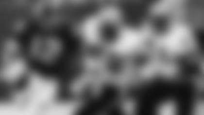 Pittsburgh Steelers quarterback Terry Bradshaw rolls out of the pocket looking for a receiver as New Orleans Saints defenders Elois Grooms (78) and Derland Moore apply the pressure in the Superdome in New Orleans on Oct. 6, 1981. Terry and the Steelers prevailed 20-6.