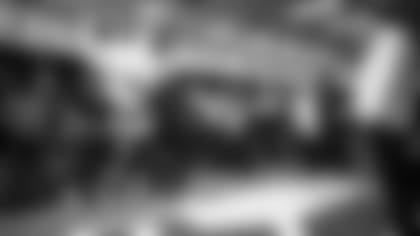 Seahawks head coach Pete Carroll talks his team in the locker room after the 27-13 loss the the Cardinals.