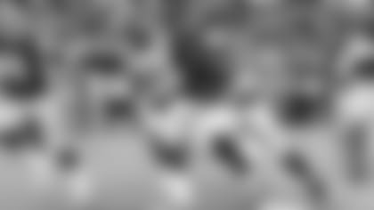 Seahawks defensive end Jadeveon Clowney recovers a fumble caused by teammate Jarran Reed and heads for the end zone in the second quarter.