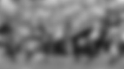 Seahawks quarterback Russell Wilson fires a pass downfield in the first quarter. Wilson completed 29 of 35 passes for 300 yards and three touchdowns on the afternoon.