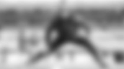 Seahawks linebacker Shaquem Griffin stretches on the grass at Bank of America Stadium in Charlotte before facing the Panthers.